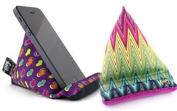 Geometric designs printed on pyramid-shaped squishy cell phone holders.